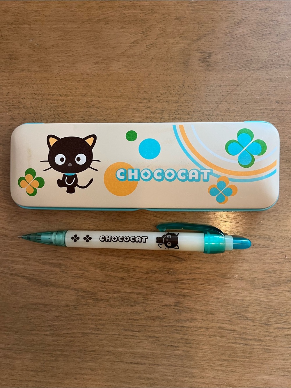 Sanrio White and Teal Metal Pencil Case Featuring Clover Motif includes Pen.
